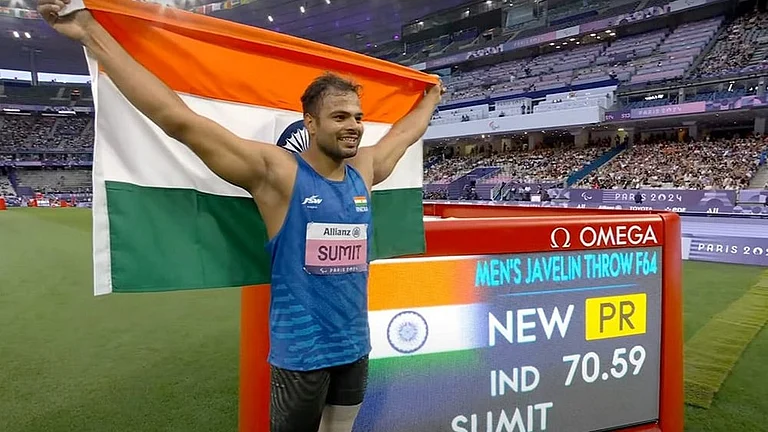 2024 Paris Paralympics: Sumit Antil poses for photographs after winning the gold medal in javelin throw F64 event - | Photo: PTI